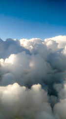 Fototapeta na wymiar Flying in Clouds