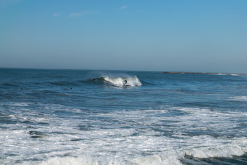 Surfing waves on the ocean in Portugal