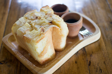 Honey toast topping by almond slice and chocolate syrup, selective focus