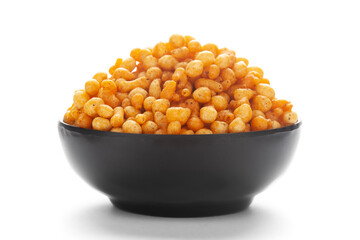 Close up of crunchy masala boondi Indian namkeen (snacks) on a ceramic black bowl.