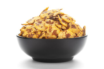 Close-up of Spicy Chana Jor Garam in a black Ceramic bowl, made with air-fried Bengal Chickpea....