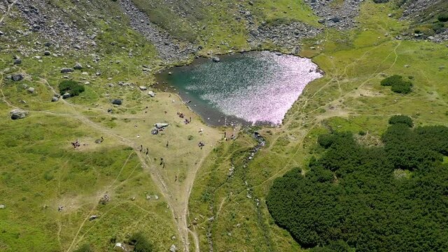 Flying above Iezer glacial lake, Rodnei mountains, Eastern Carpathians, Romania