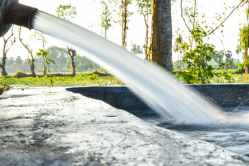 water is flowing through a pipe in agriculture land