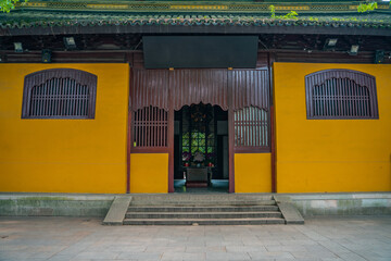 Inside view of a Buddhist temple in China, with yellow wall.