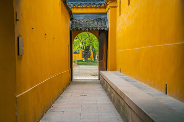 Inside view of a Buddhist temple in China, with yellow wall.