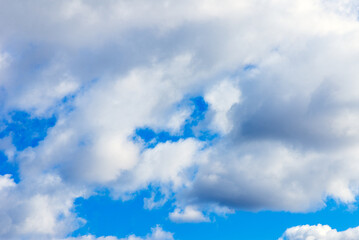 Naklejka na ściany i meble Dramatic blue sky with white clouds background.