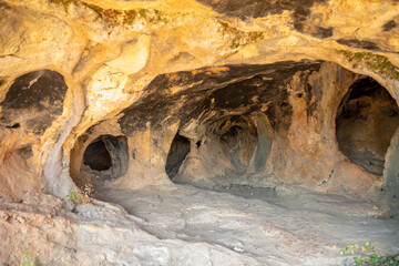 Inside view of Karain Cave in Antalya, with natural stalactites and stalagmites around in Turkey
