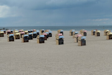 Many beach chairs stand side by side on the long, fine sandy beach on the Baltic Sea. Travemünde, Schleswig-Holstein,  Germany. 