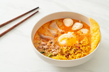 egg noodles with pork and meatball in spicy soup