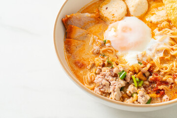 instant noodles with pork and meatballs in spicy soup