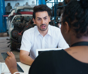 Man work with woman, he shocking from her price. Diversity of two people, caucasian business manager shocking on offering price of African worker woman in factory-warehouse