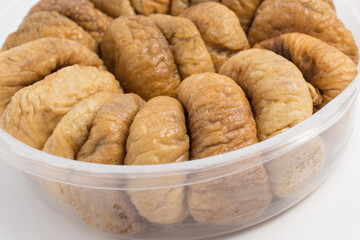 dried figs in round package isolated white background