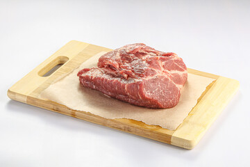 Raw pork neck over board
