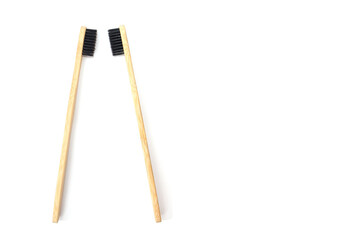 two bamboo toothbrushes isolated on white background.