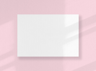 Blank square card, white sheet as mockup with sunny shadows on pink surface.