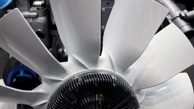 The engine cooling fan, which blows the radiator