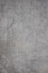 Rough gray concrete surface with design