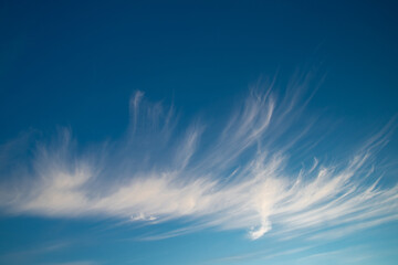 White Cirrostratus Clouds On Blue Sky.