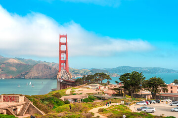 Fototapeta na wymiar Golden Gate Bridge from the hill on a sunny summer day, postcard view of San Francisco landmarks