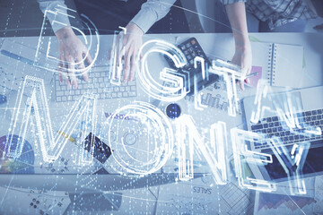 Double exposure of man and woman working together and crypto theme hologram drawing. Computer background. Blockchain concept. Top View.