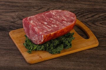 Beef ham piece over board