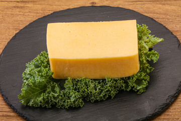 Tasty yelloow Tilsiter cheese brick