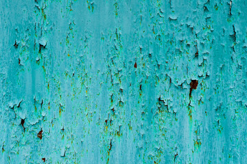 photo of metal with old paint. rust under the paint.