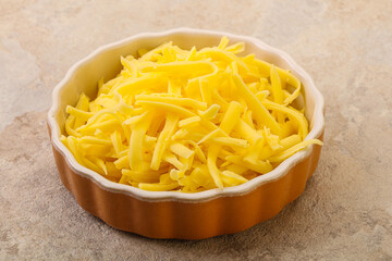 Shredded yellow cheese in the bowl