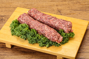Raw minced beef kebab skewer