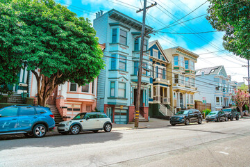 Fototapeta na wymiar Facades of townhouses with famous Victorian architecture, streets in San Francisco