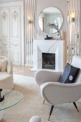 rich luxurious interior of a cozy room with modern stylish furniture nd grand piano, decorated with baroque columns and stucco on the walls