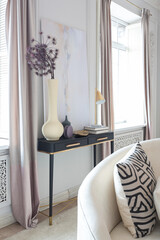 rich luxurious interior of a cozy room with modern stylish furniture nd grand piano, decorated with baroque columns and stucco on the walls