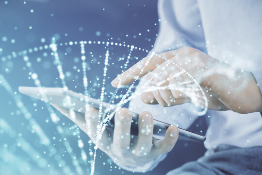 Double exposure of man's hands holding and using a phone and DNA drawing. Medical education concept.