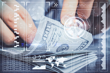Double exposure of technology drawing hologram and us dollars bills and man hands. Data concept