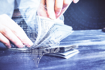 Multi exposure of brain drawing hologram and us dollars bills and man hands. Ai invest concept