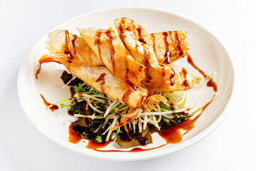 spring rolls with sauce and salad