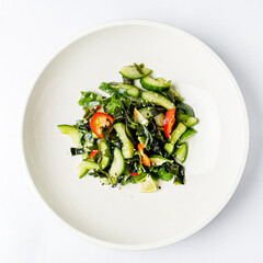salad with seaweed on the white plate