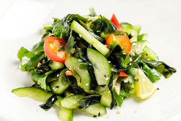 salad with seaweed on the white plate