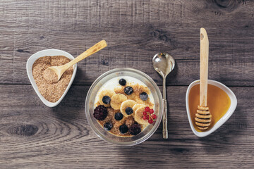 Fresh yogurt with wheat bran and banana and berries