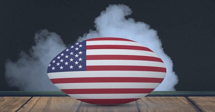 Compostion of rugby ball of usa flag on black background with white smoke