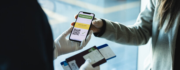 Tourist check in using immunity passport app in mobile phone for travel