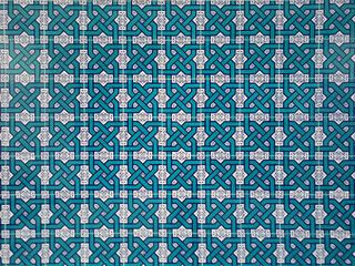 blue patterns in oriental style on antique ceramic tiles. color background