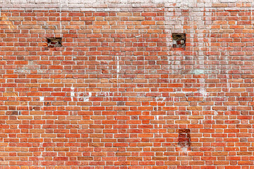 Old Red Brick Wall with Lots of Texture surface backdrop copy space. Horizontal seamless texture