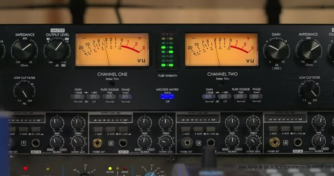 Dual VU meter sound level indicator. Peak program meter. Classic moving needle device. Professional studio audio equipment.