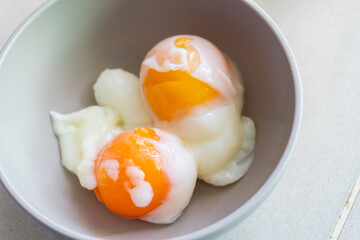 delicious and healthy half boil egg on a bowl