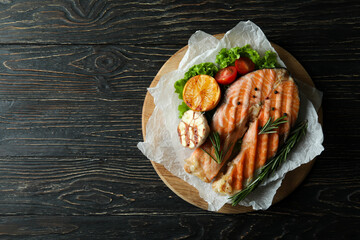 Concept of tasty eating with grilled salmon, space for text