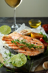 Concept of tasty eating with grilled salmon, close up