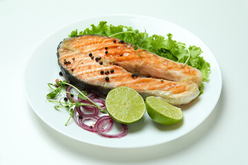Concept of tasty eating with grilled salmon on white background