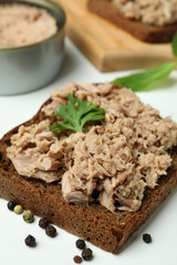 Tasty tuna sandwiches on white background, close up