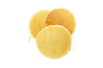 Tasty pancakes with honey isolated on white background
